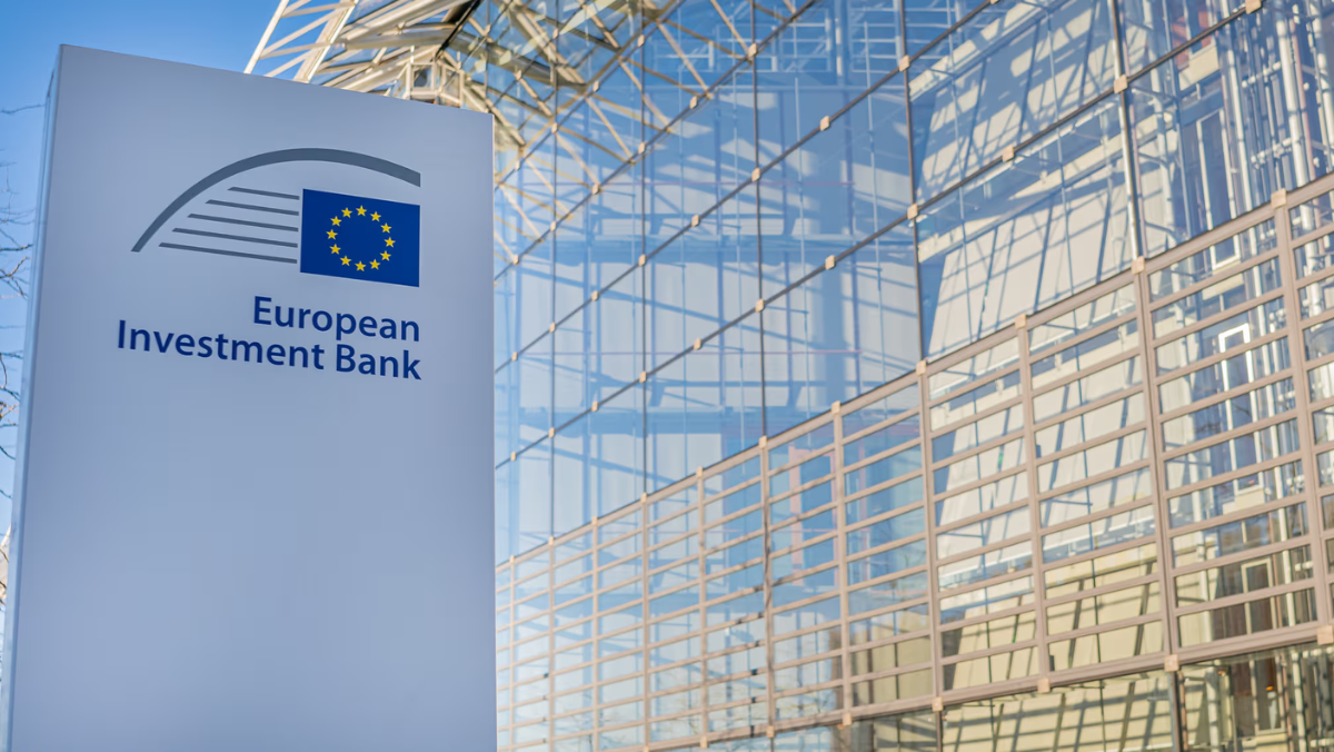 European Investment Bank sign in front of modern glass building representing EU water investment.