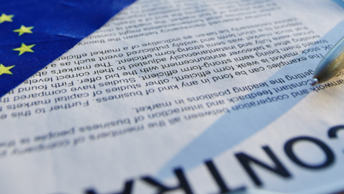 EU flag and official document symbolising changes to European procurement rules