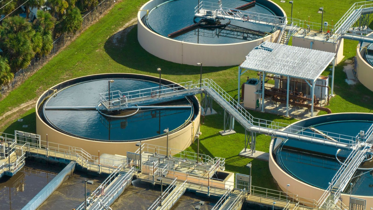 Aerial view of circular treatment tanks at a European water utility facility