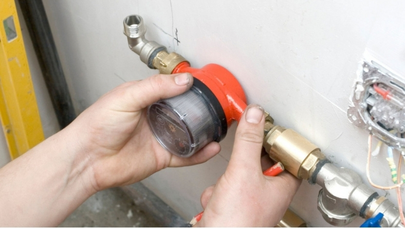 Smart water meter installation on pipeline for leak detection and usage monitoring