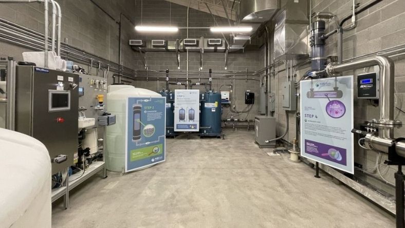 Water treatment facility interior with digital control systems and industrial tanks